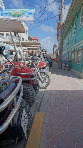 San Pedro Ambergris Caye Golf Carts Parked In Street. – Best Places In The World To Retire – International Living